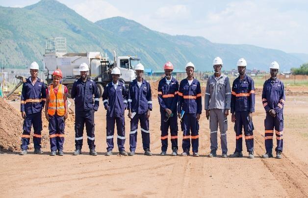 Spary Race project personnel in safety helmets at a worksite
